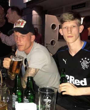 Connor Newall enjoying a drink with his elder brother Andrew.